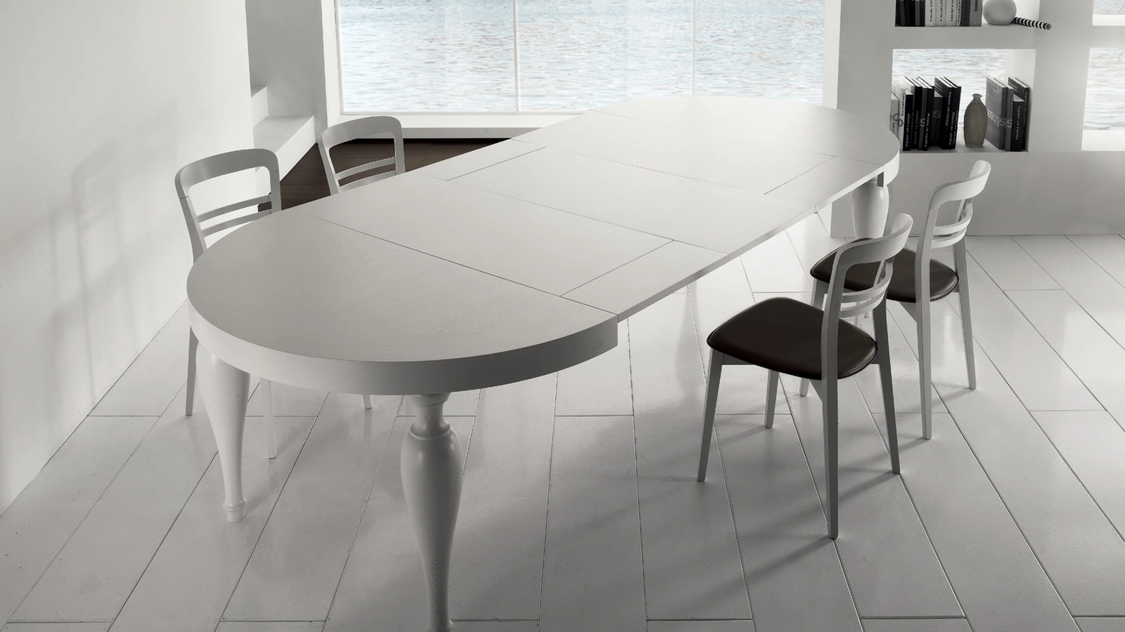 Tavolo rotondo allungabile Bridge in legno con gambe in massello di Gipi Le Sedie