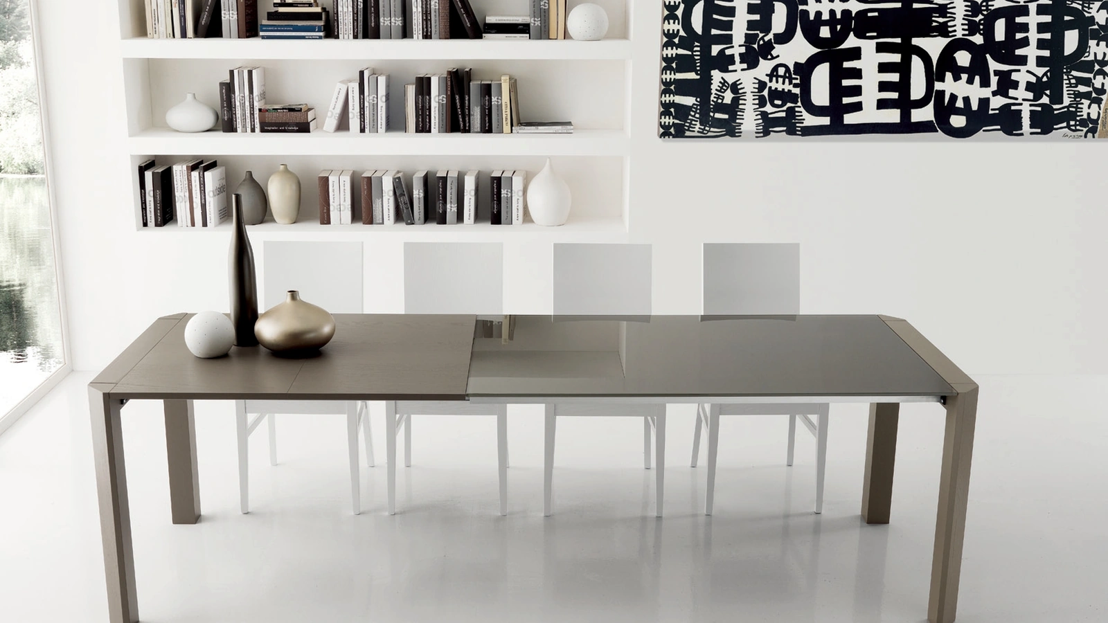 Tavolo allungabile Sting in vetro con gambe in frassino massello di Gipi Le Sedie